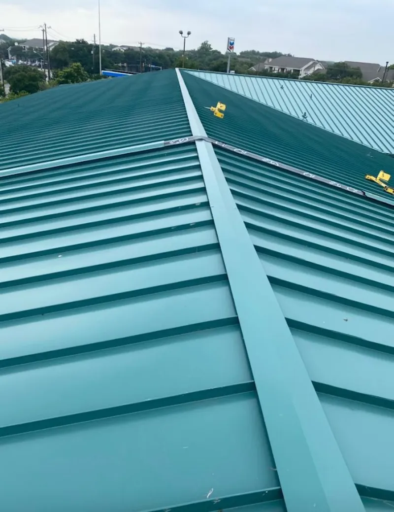 Green commercial metal roof ridge and valley for Metal Roof Repair in Clifton Park